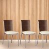 Silla de caño tapizada, con respaldo de madera. Modelo "S8000P", de Dielfe.